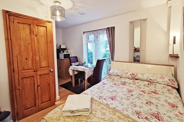 Cosy small double bedroom with double bed at Netherleigh B&B, Axminster, Devon